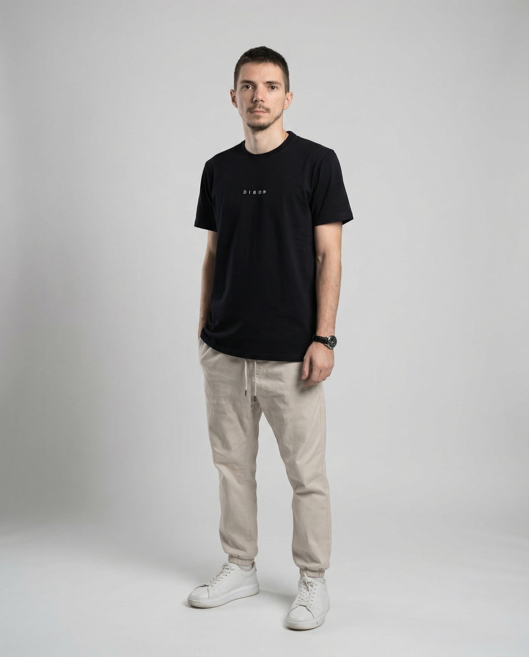 DIBON men’s black t-shirt photographed from an angle, modern and luxurious look