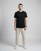 DIBON men’s black premium t-shirt with minimalist design, clean front view on model