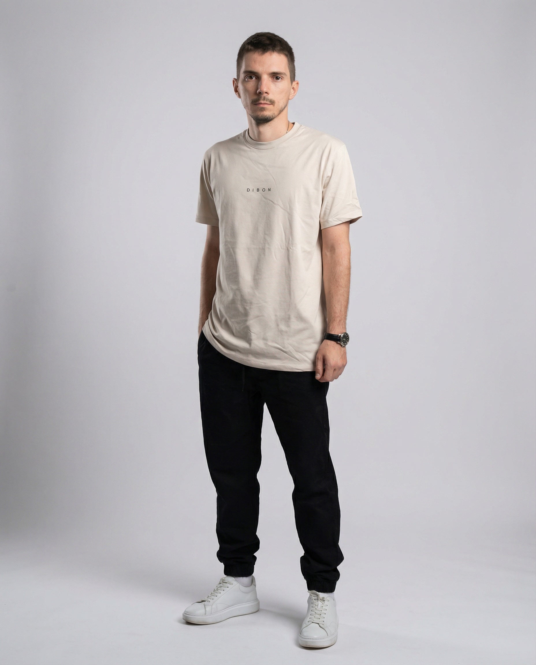 DIBON men’s cream t-shirt photographed at an angle, contemporary and luxury feel