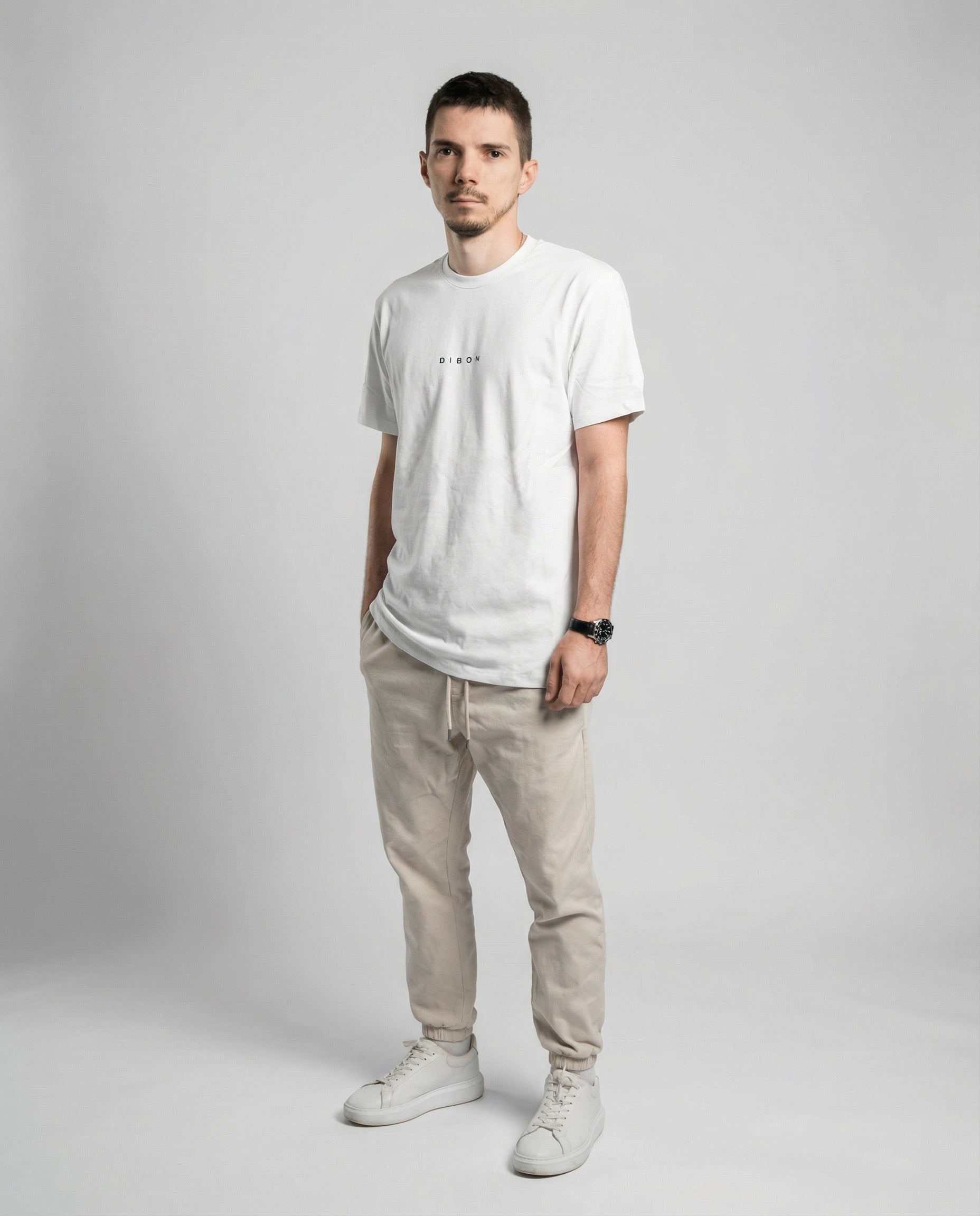 DIBON men’s white t-shirt captured from an angled perspective, sophisticated style