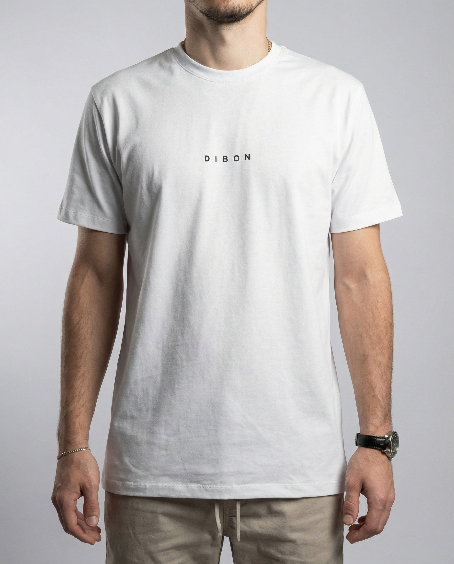 Zoomed-in detail of DIBON white men’s t-shirt emphasizing premium craftsmanship