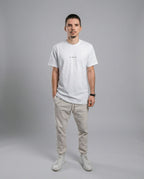 DIBON men’s white premium t-shirt with minimalist aesthetic, front view on model